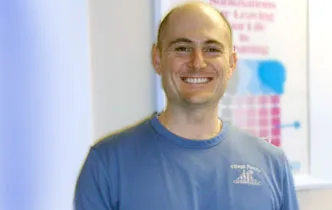 Dr. Brian Douglas smiling in the office